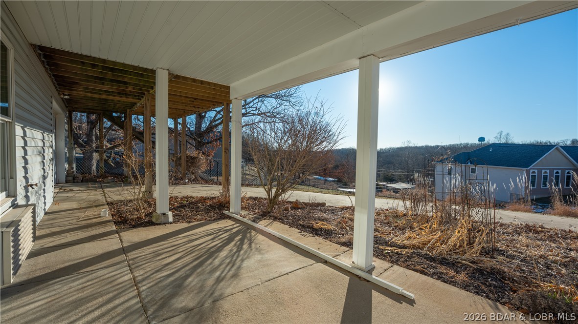 46 Watkins Road Camdenton, MO 65020 - Photo 38 of 50 Covered patio under sunroom