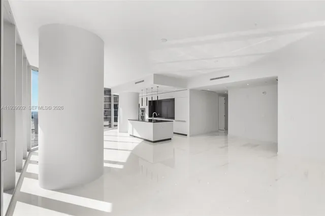a kitchen with granite countertop a sink and a stove top oven