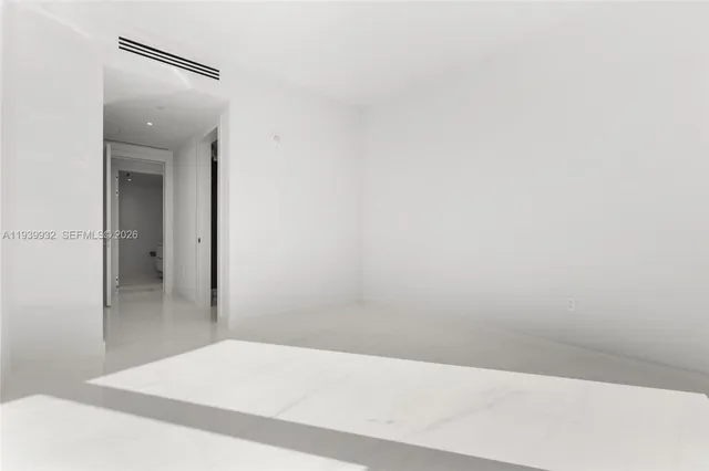 a view of an empty room with a balcony