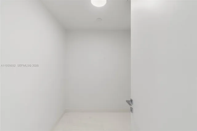 a view of a kitchen with a sink and a window