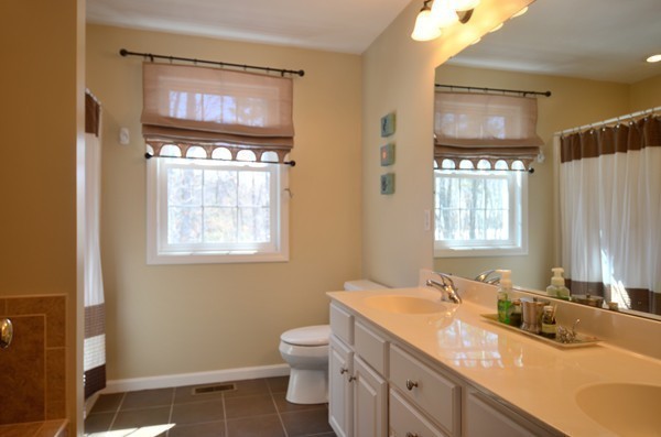 376 Mulpus Road Lunenburg, MA 01462 - Photo 15 of 27 a bathroom with 2 sink toilet and a mirror