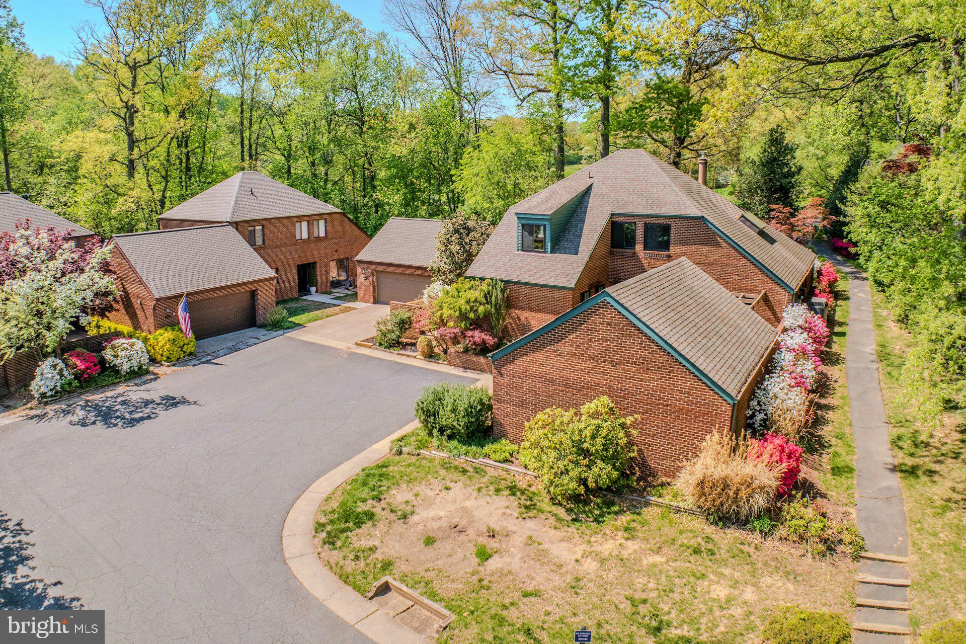Brick patio home with detached two car garage.