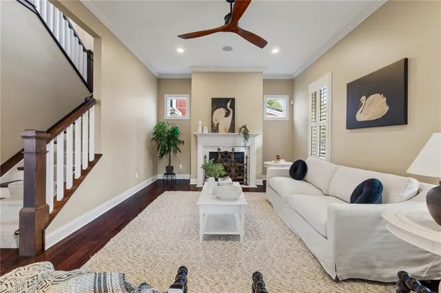 a living room with furniture and a painting