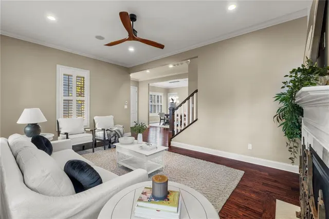 a living room with furniture and a potted plant