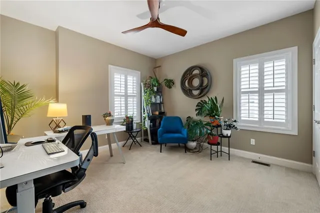 a view of a livingroom with furniture and a window