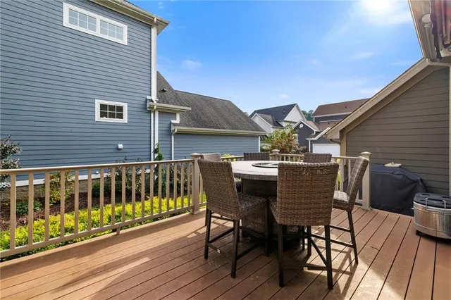 a view of a chairs and table on the deck