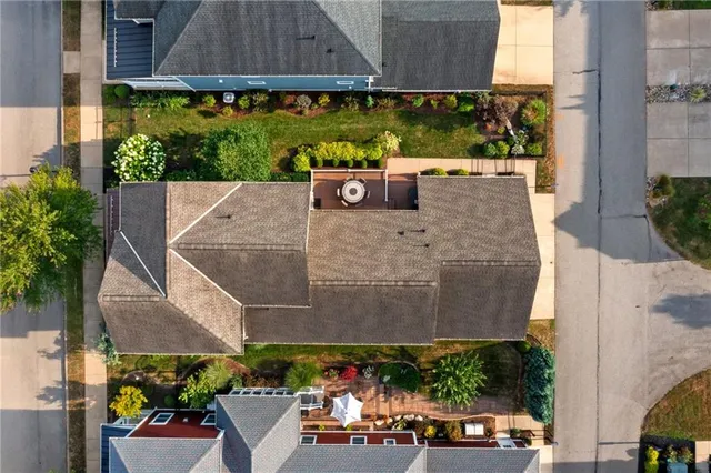 an aerial view of a house with a yard