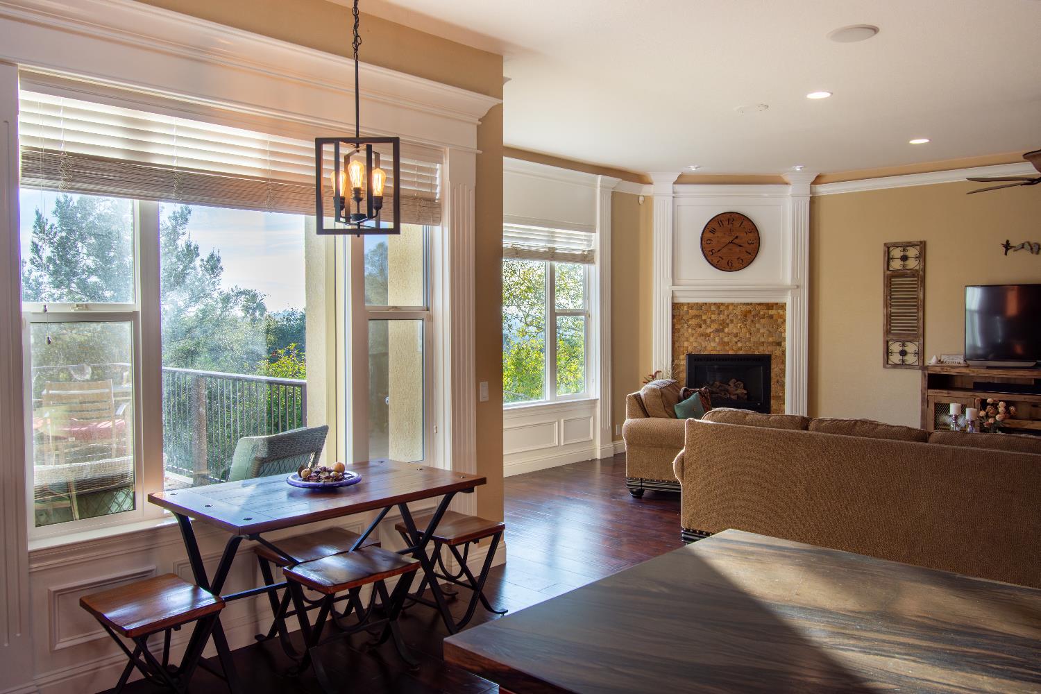 3388 Sudbury Road Cameron Park, CA 95682 - Photo 16 of 55 a living room with furniture a flat screen tv and a large window