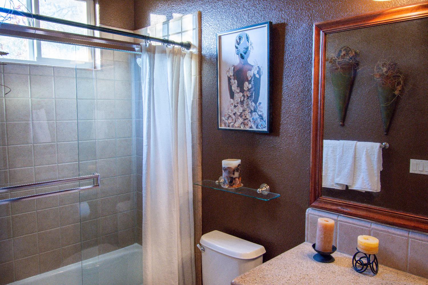 3388 Sudbury Road Cameron Park, CA 95682 - Photo 17 of 55 a bathroom with a toilet and a shower