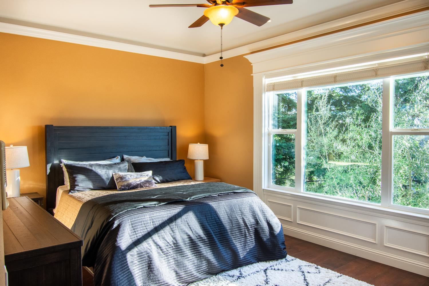 3388 Sudbury Road Cameron Park, CA 95682 - Photo 22 of 55 a bedroom with a bed and a chandelier