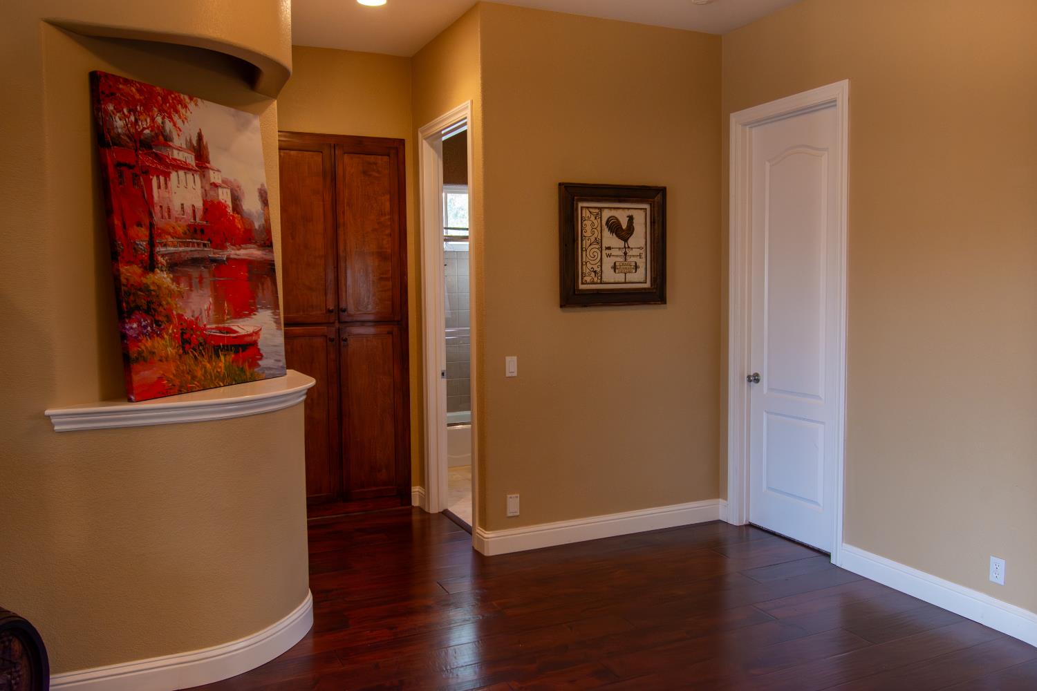 3388 Sudbury Road Cameron Park, CA 95682 - Photo 5 of 55 a view of a hallway with wooden floor