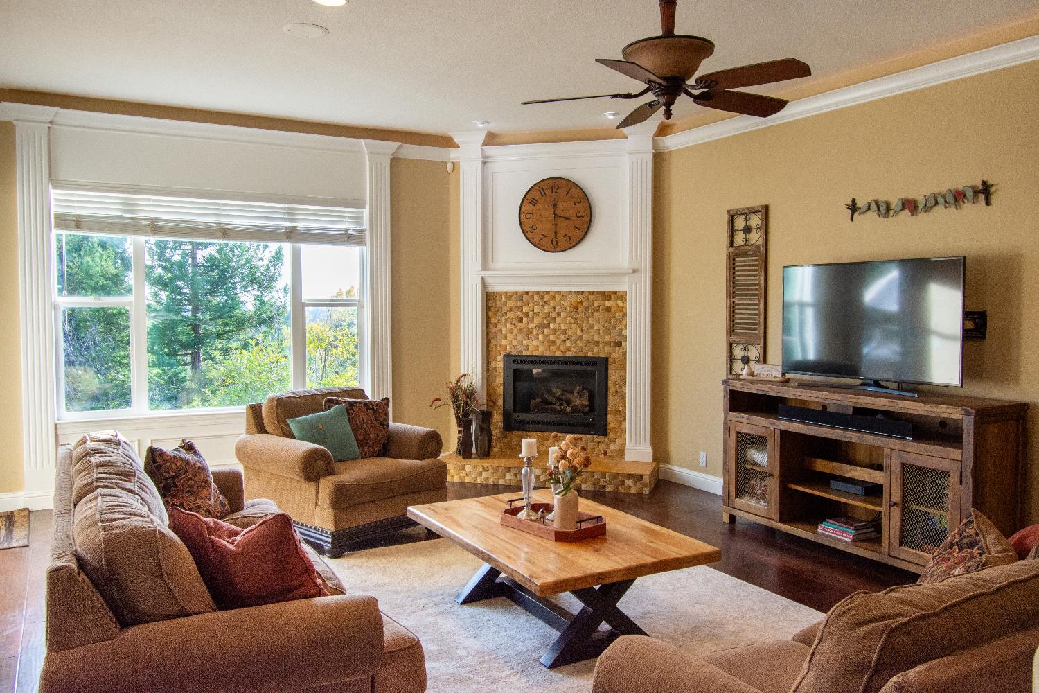3388 Sudbury Road Cameron Park, CA 95682 - Photo 6 of 55 a living room with furniture a flat screen tv and a fireplace