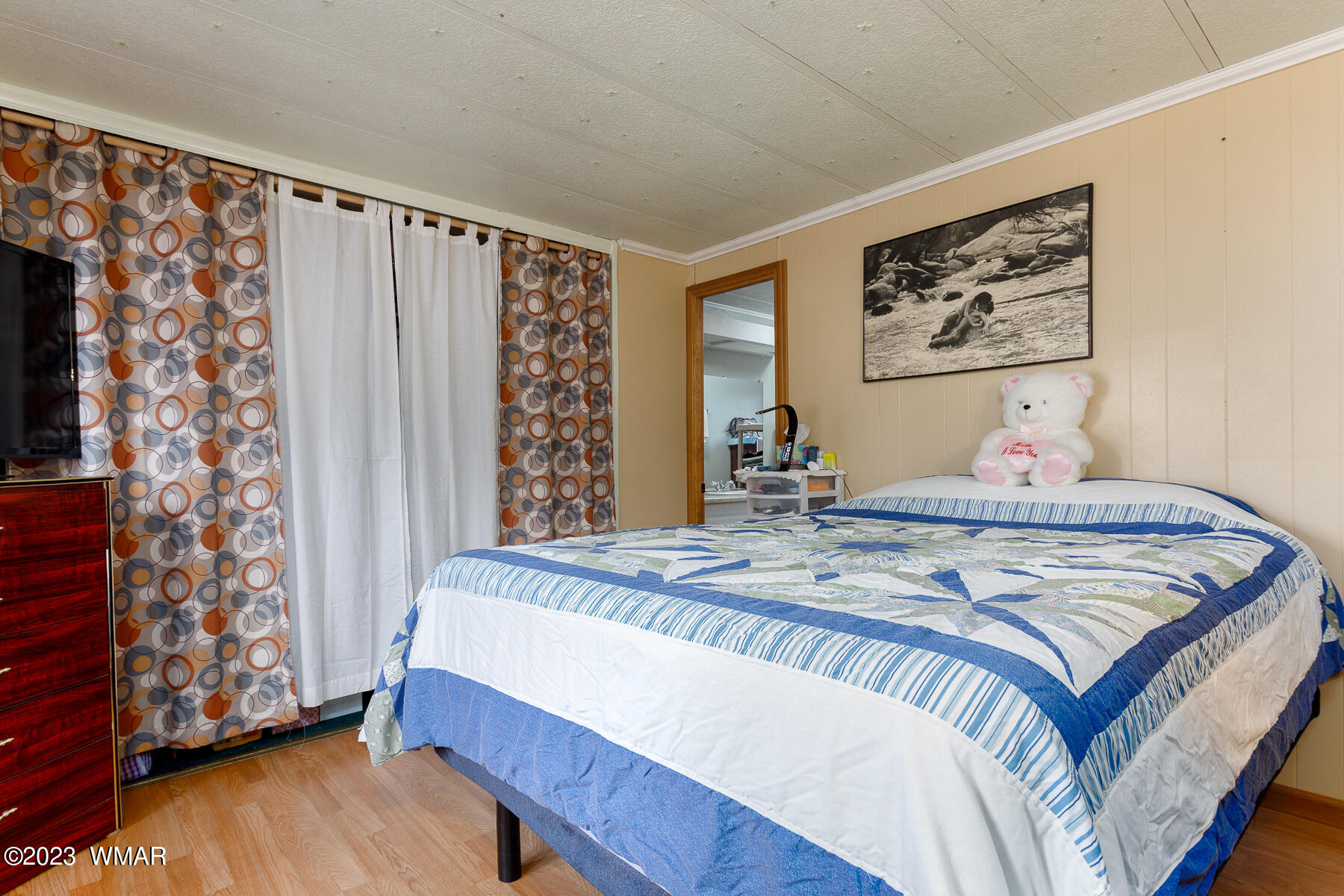 3439 Top View Road Overgaard, AZ 85933 - Photo 12 of 24 a bedroom with a bed and wooden floor