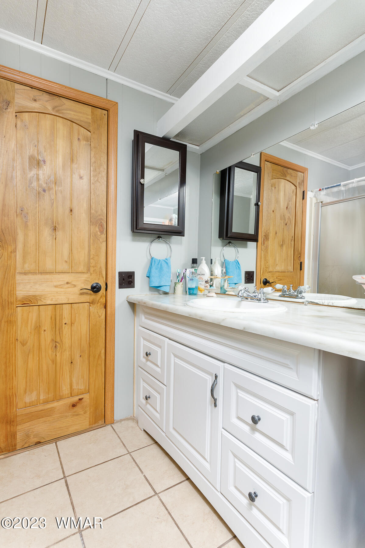 3439 Top View Road Overgaard, AZ 85933 - Photo 14 of 24 a bathroom with a sink a mirror and a shower