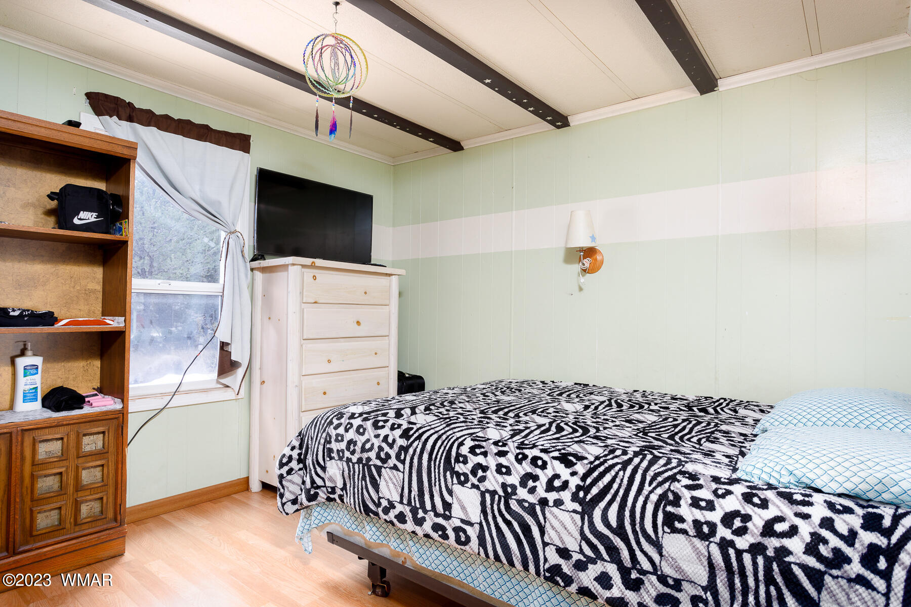 3439 Top View Road Overgaard, AZ 85933 - Photo 17 of 24 a bedroom with a bed and a dresser