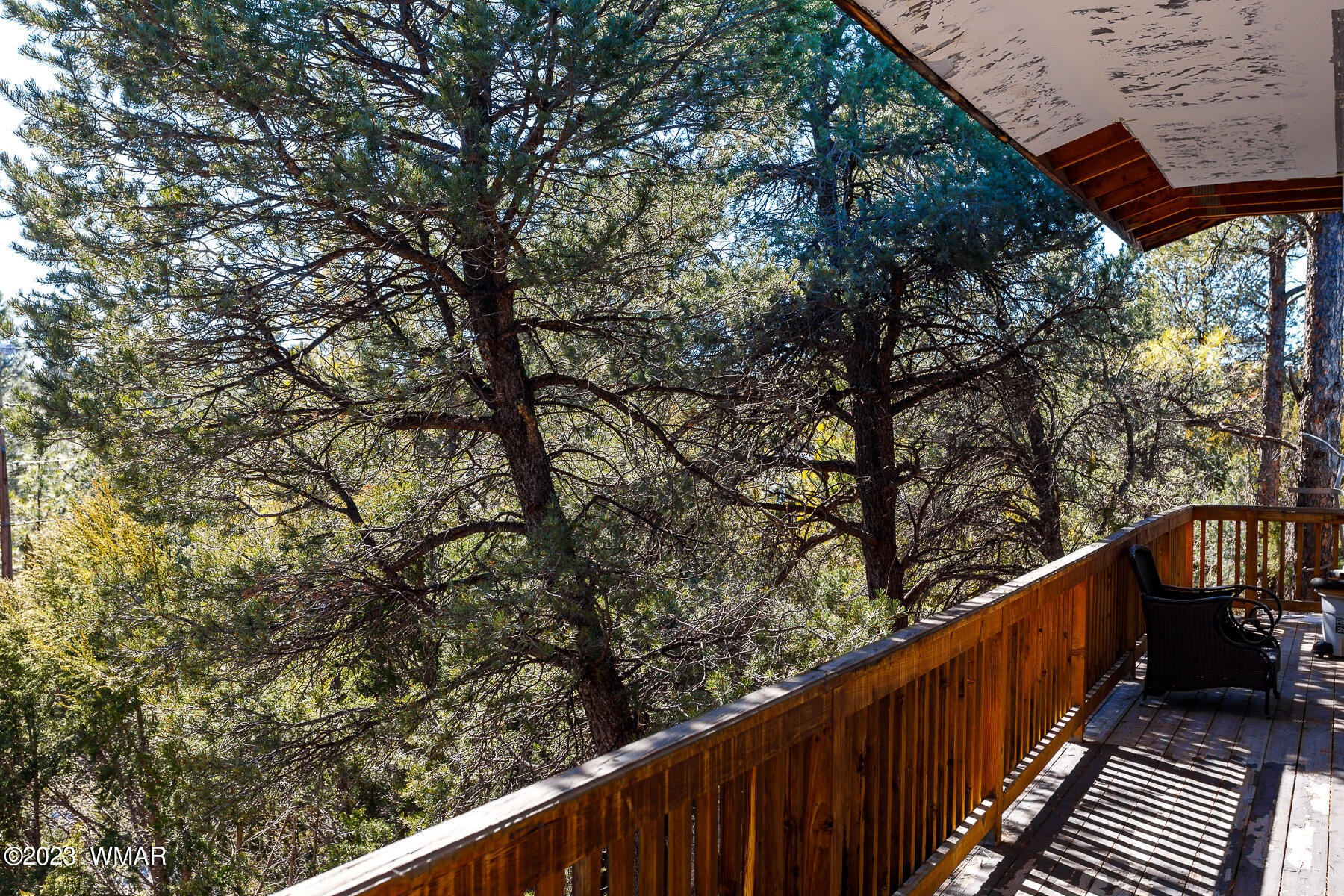 3439 Top View Road Overgaard, AZ 85933 - Photo 20 of 24 a balcony with wooden fence and floor