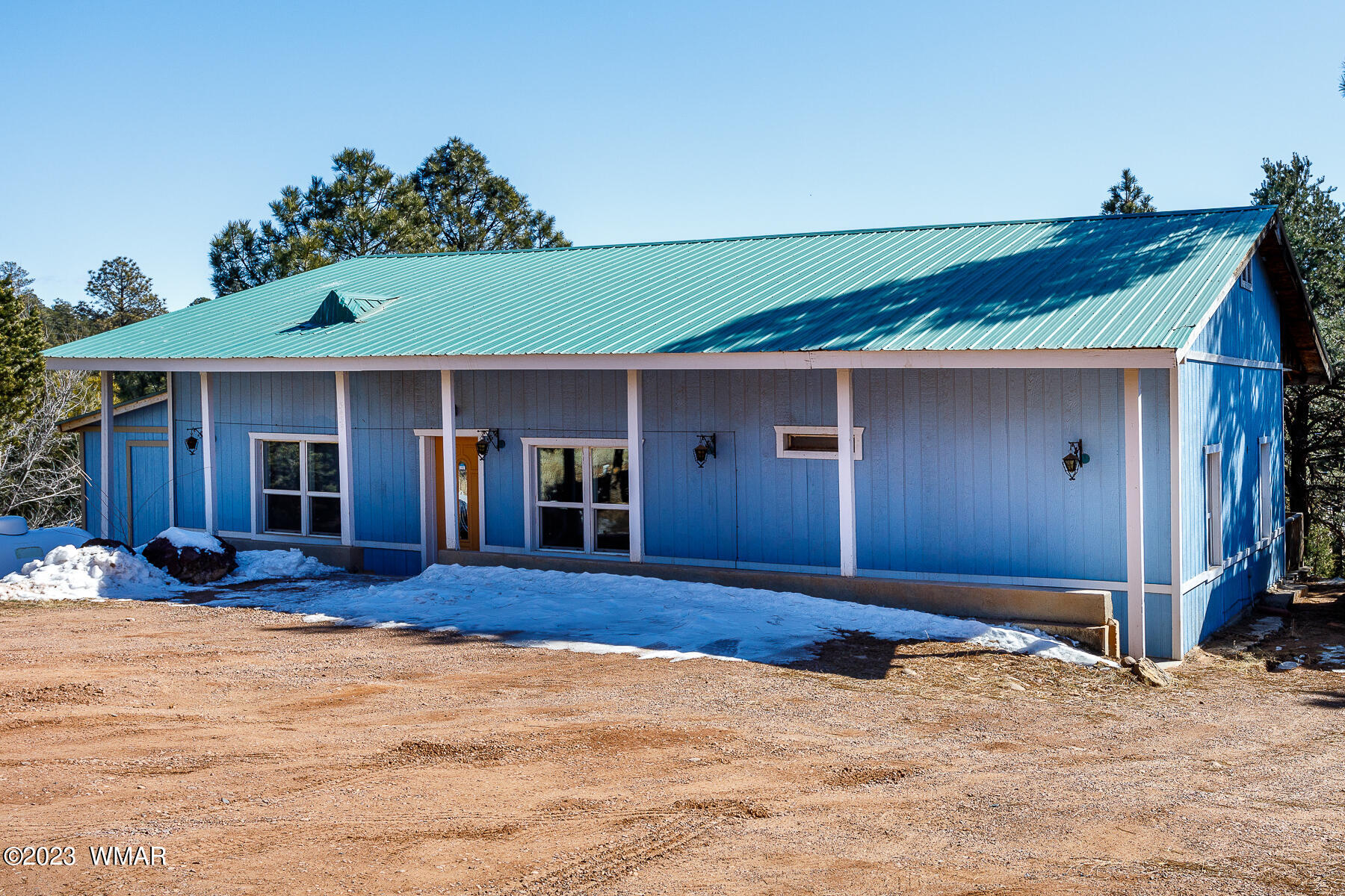 3439 Top View Road Overgaard, AZ 85933 - Photo 2 of 24 a front view of a house with a yard and garage