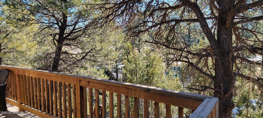 3439 Top View Road Overgaard, AZ 85933 - Photo 24 of 24 a wooden fence with trees in the background