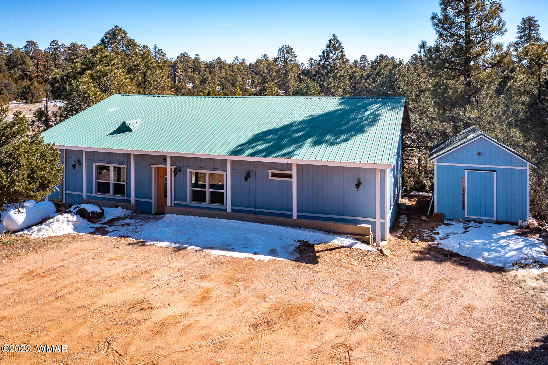 3439 Top View Road Overgaard, AZ 85933 - Photo 4 of 24 a view of a house with a yard covered in snow