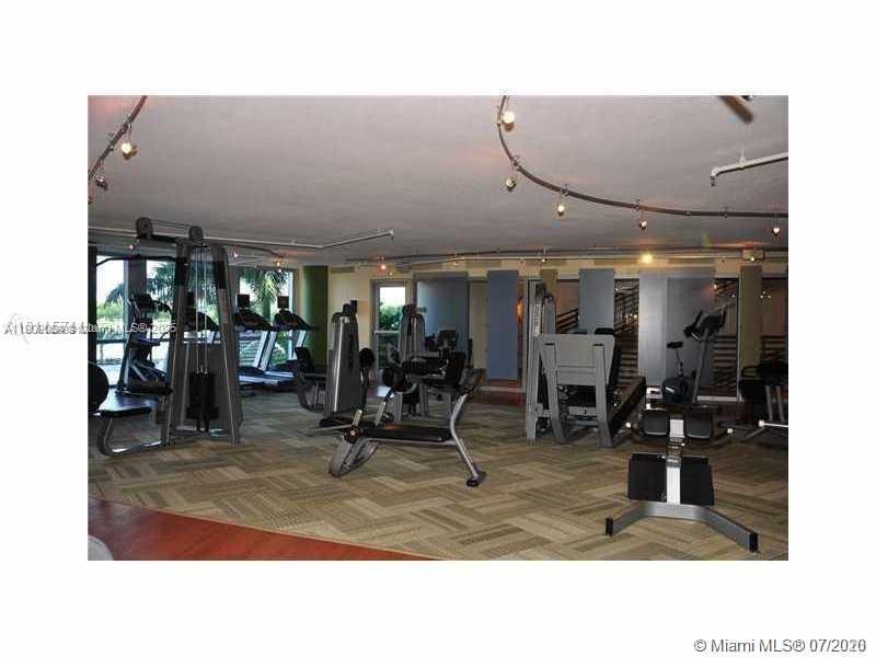 2641 North Flamingo Road, Unit 2307N Sunrise, FL 33323 - Photo 11 of 43 a room with lots of gym equipment