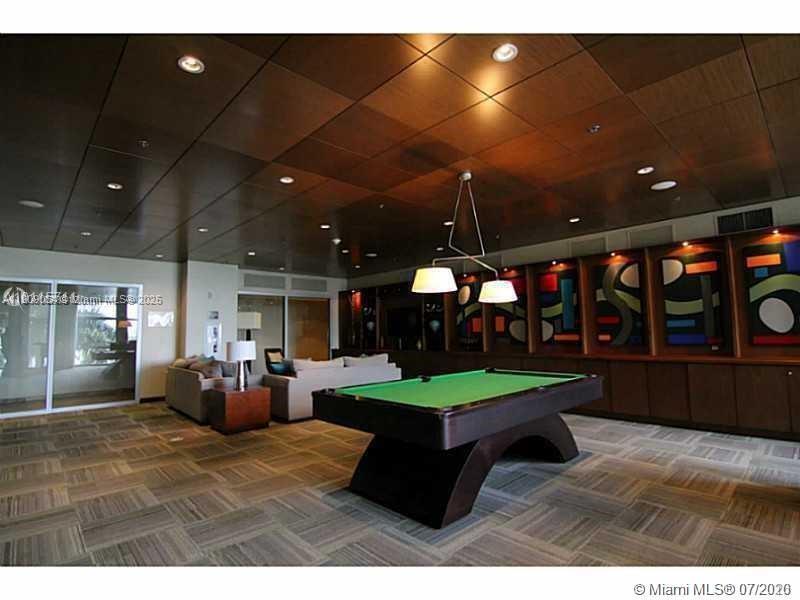 2641 North Flamingo Road, Unit 2307N Sunrise, FL 33323 - Photo 12 of 43 a room with lots of table and chairs