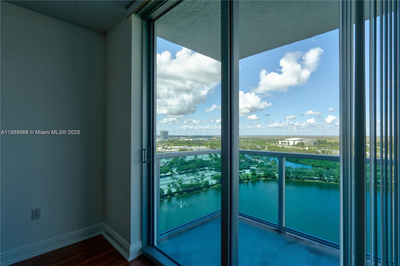 2641 North Flamingo Road, Unit 2307N Sunrise, FL 33323 - Photo 16 of 43 a view of a room with wooden floor and windows