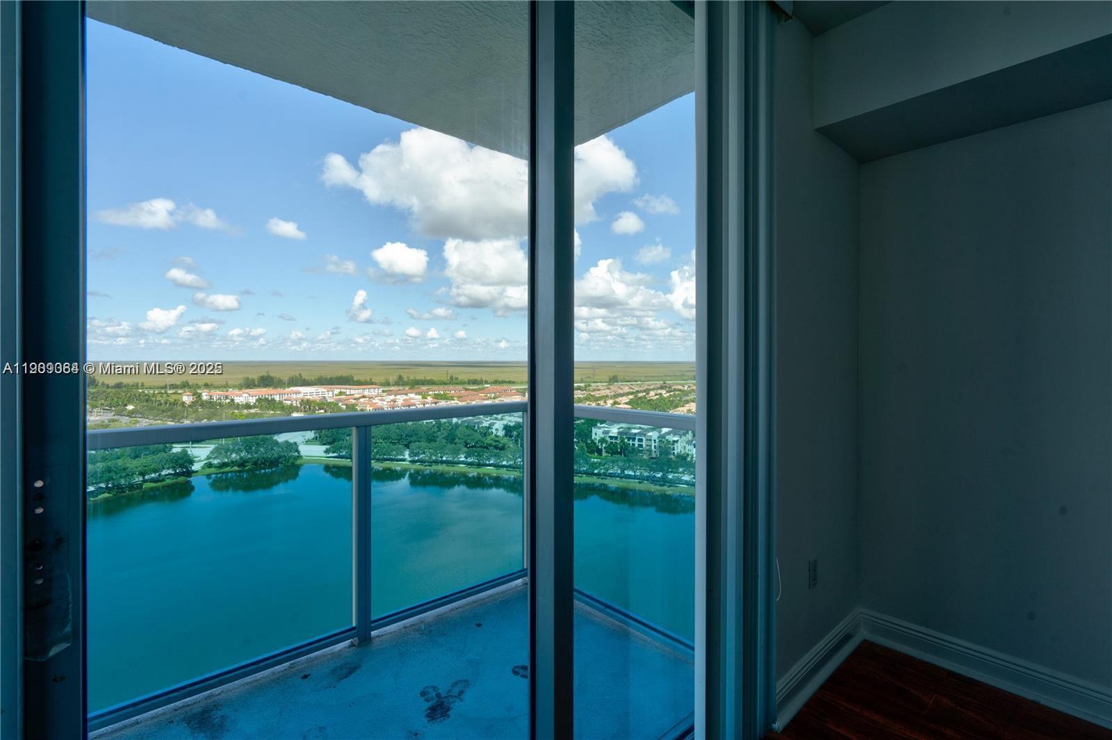 2641 North Flamingo Road, Unit 2307N Sunrise, FL 33323 - Photo 17 of 43 a view of a glass door with a lake view