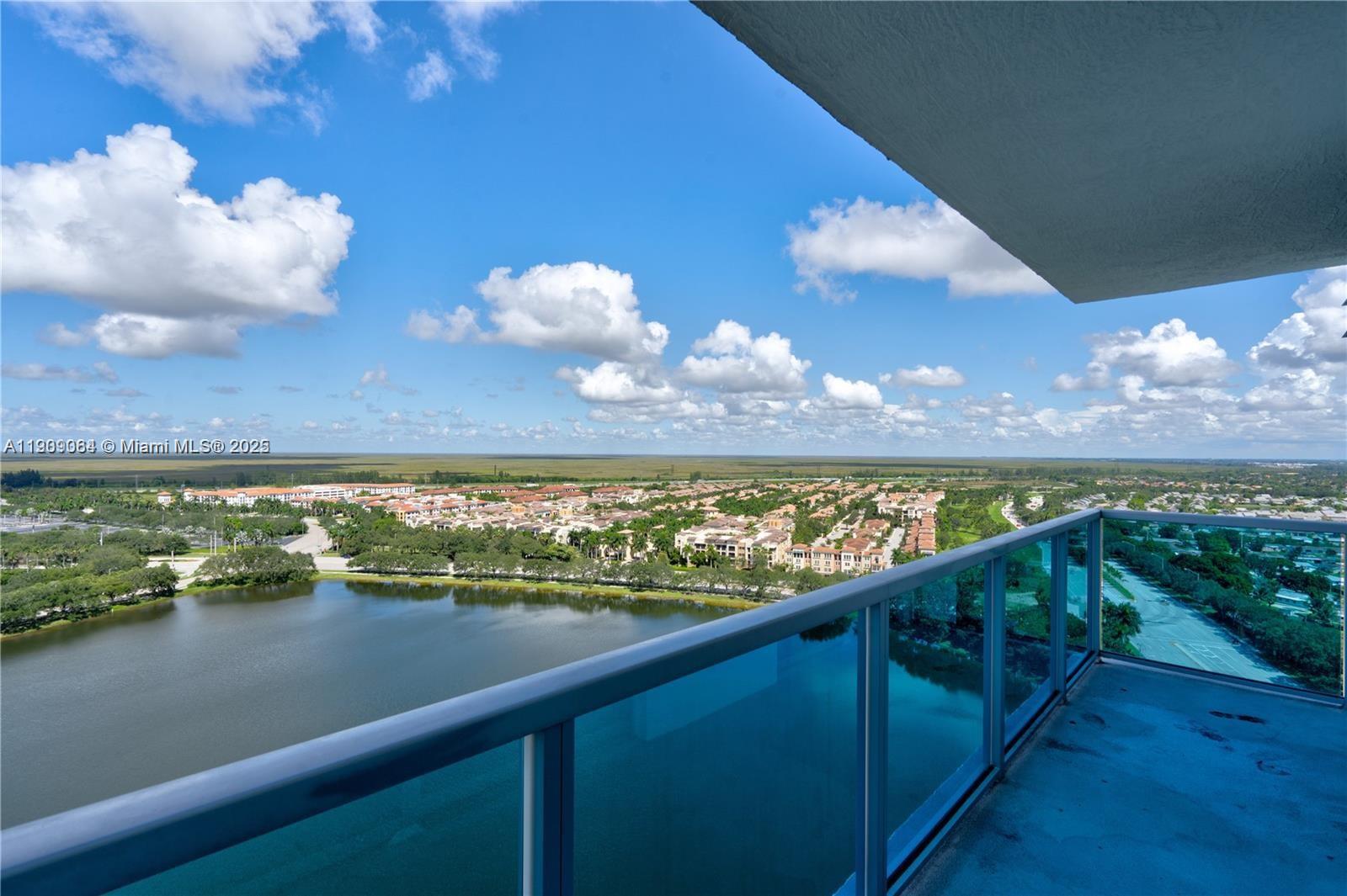 2641 North Flamingo Road, Unit 2307N Sunrise, FL 33323 - Photo 20 of 43 a view of a lake from a balcony