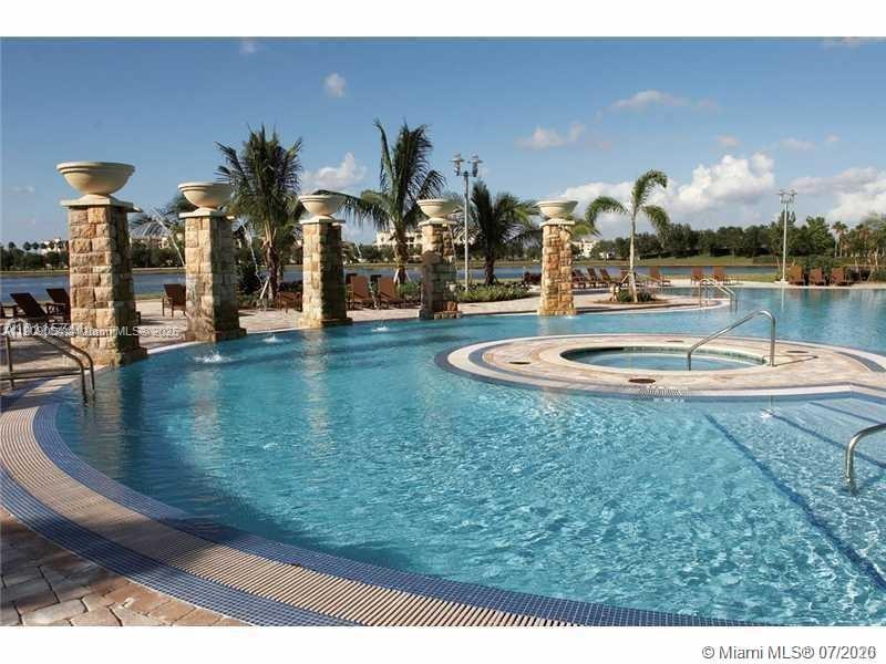 2641 North Flamingo Road, Unit 2307N Sunrise, FL 33323 - Photo 7 of 43 a swimming pool with outdoor seating and yard