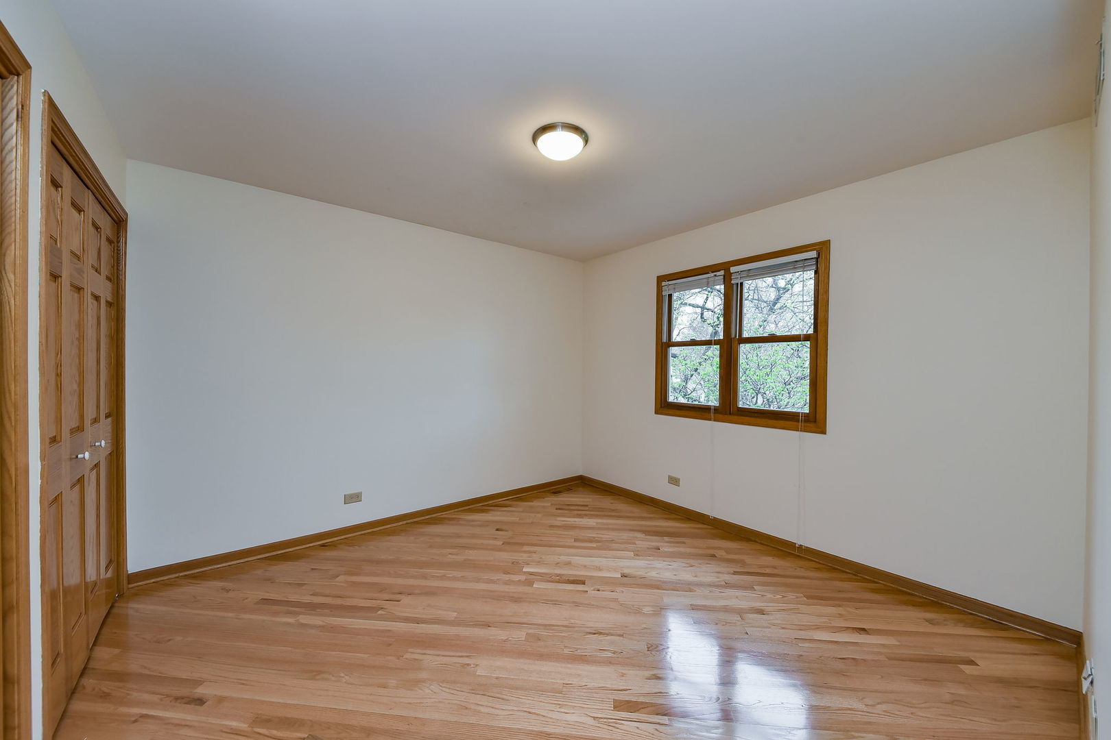 320 North Wright Street Naperville, IL 60540 - Photo 11 of 27 wooden floor in an empty room with a window