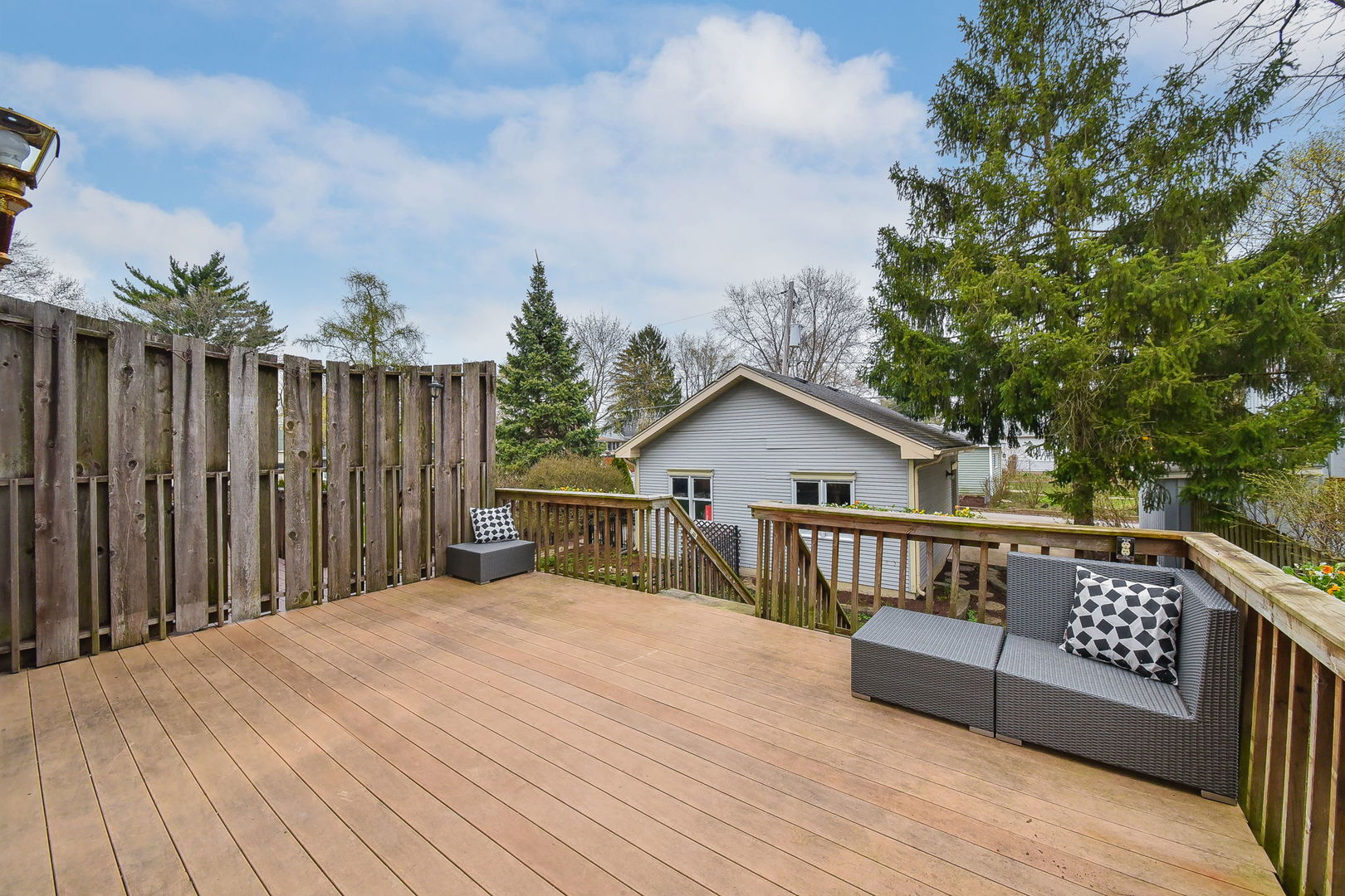 320 North Wright Street Naperville, IL 60540 - Photo 16 of 27 a view of a roof deck with wooden floor and fence