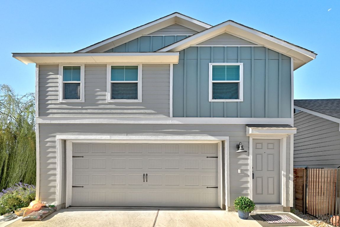 a front view of a house with a garage
