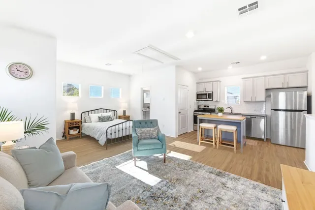 a living room with furniture and a table