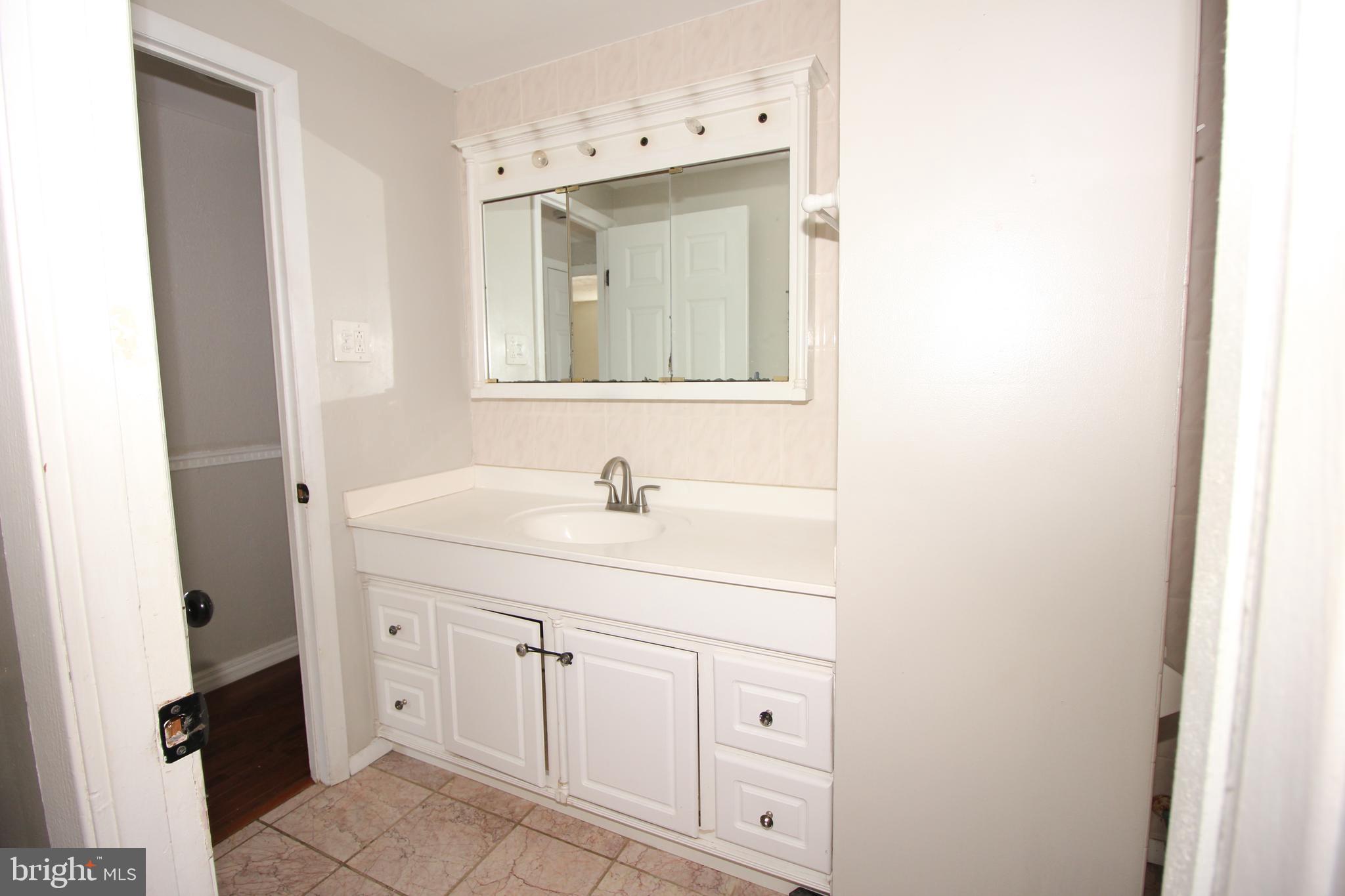 2 Twig Lane Willingboro, NJ 08046 - Photo 17 of 32 a bathroom with a sink vanity and mirror
