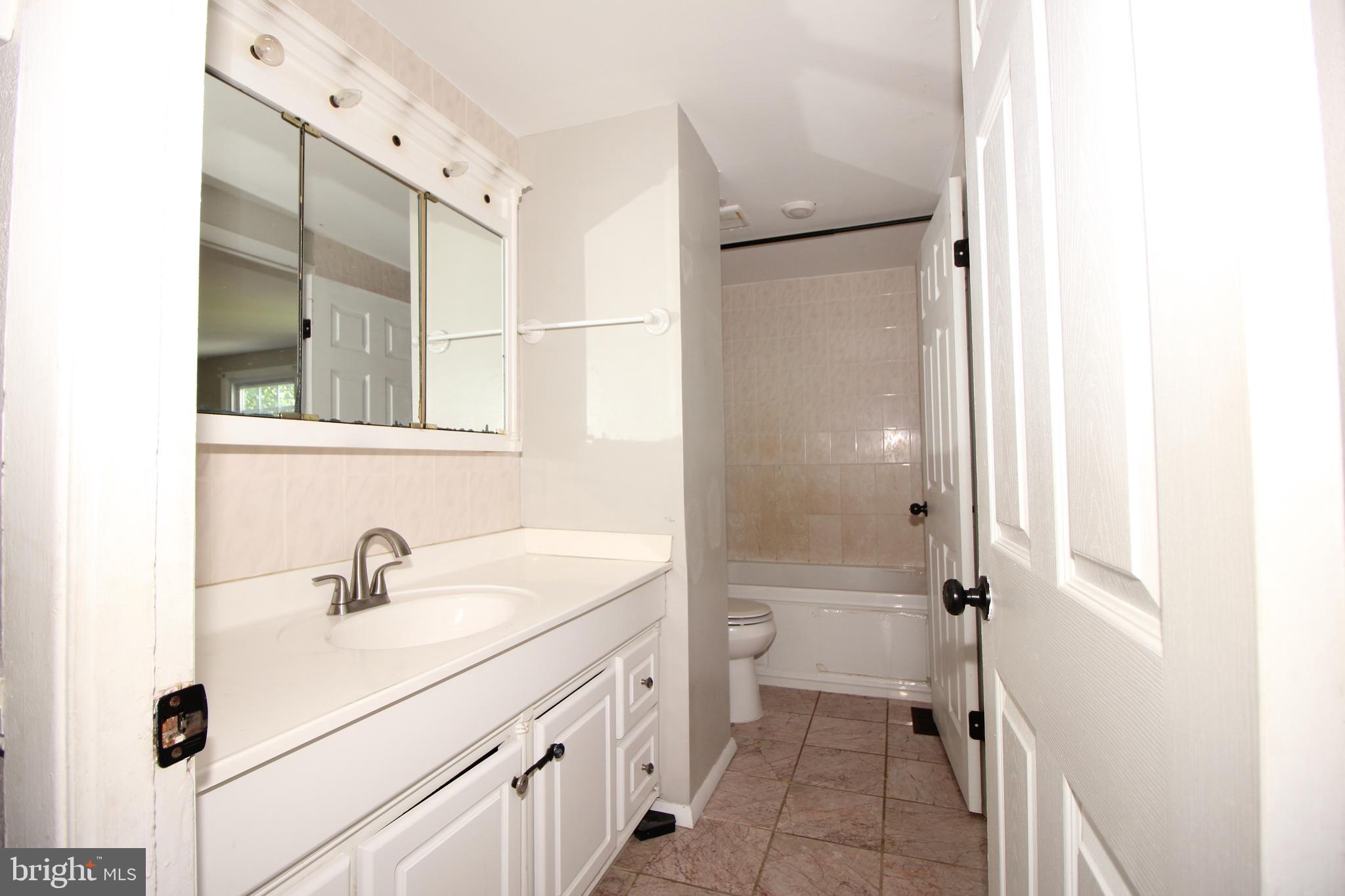 2 Twig Lane Willingboro, NJ 08046 - Photo 18 of 32 a bathroom with a sink a toilet and shower