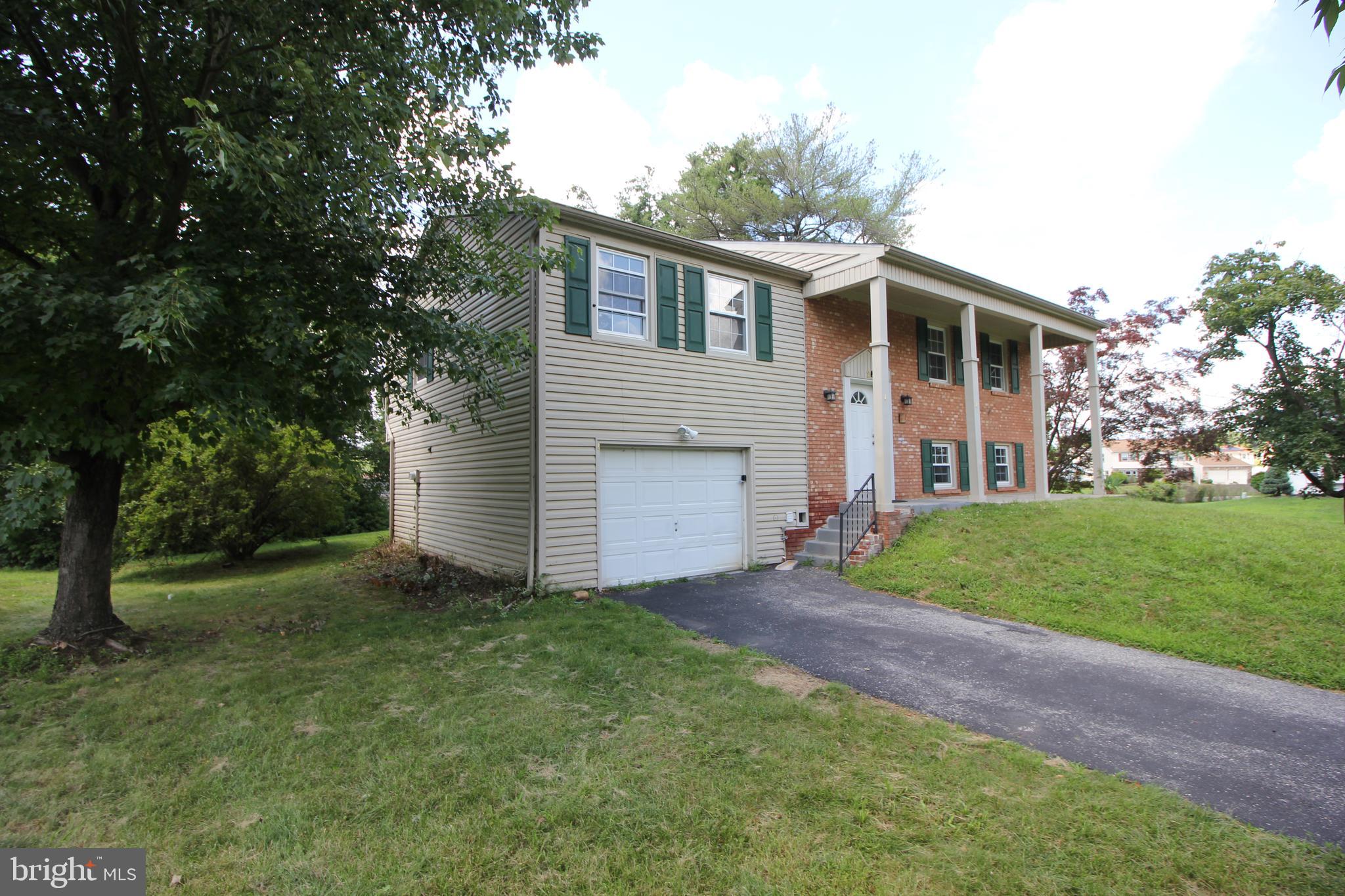 2 Twig Lane Willingboro, NJ 08046 - Photo 2 of 32 a front view of a house with a garden and yard