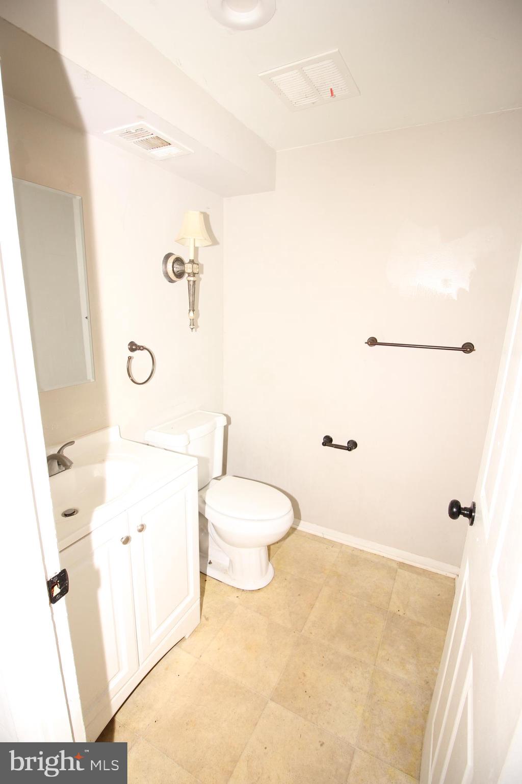 2 Twig Lane Willingboro, NJ 08046 - Photo 25 of 32 a bathroom with a granite countertop sink a toilet and shower