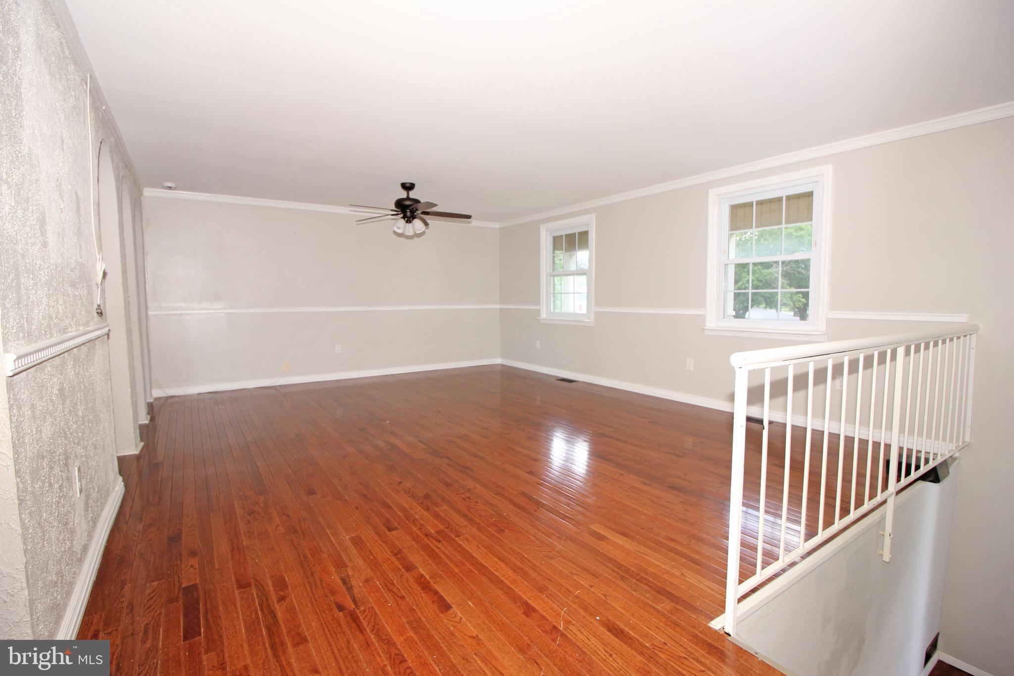 2 Twig Lane Willingboro, NJ 08046 - Photo 5 of 32 an empty room with wooden floor windows and entryway