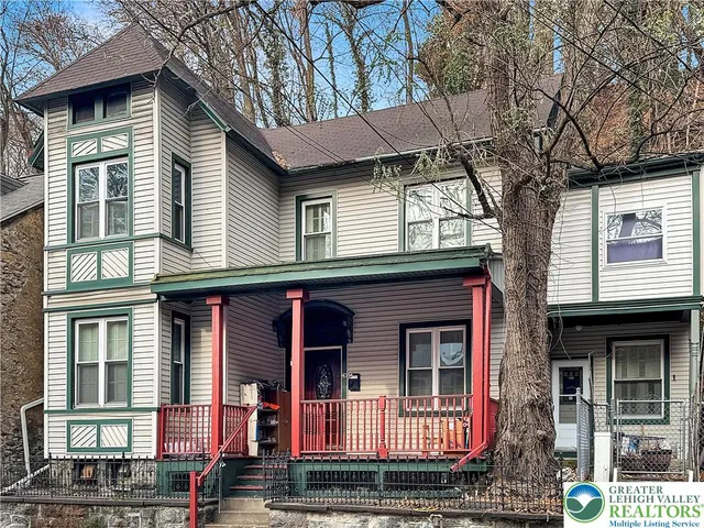 a view of a porch with wooden floor and fence