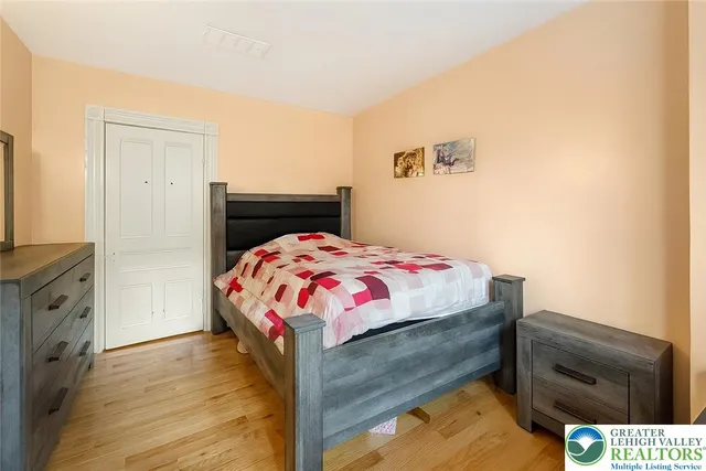 a bedroom with a bed and window