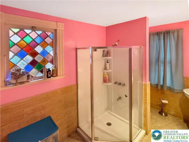 a bathroom with a sink vanity mirror and toilet