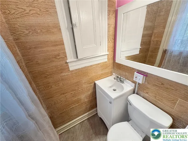 a view of a porch with a chair and a potted plant