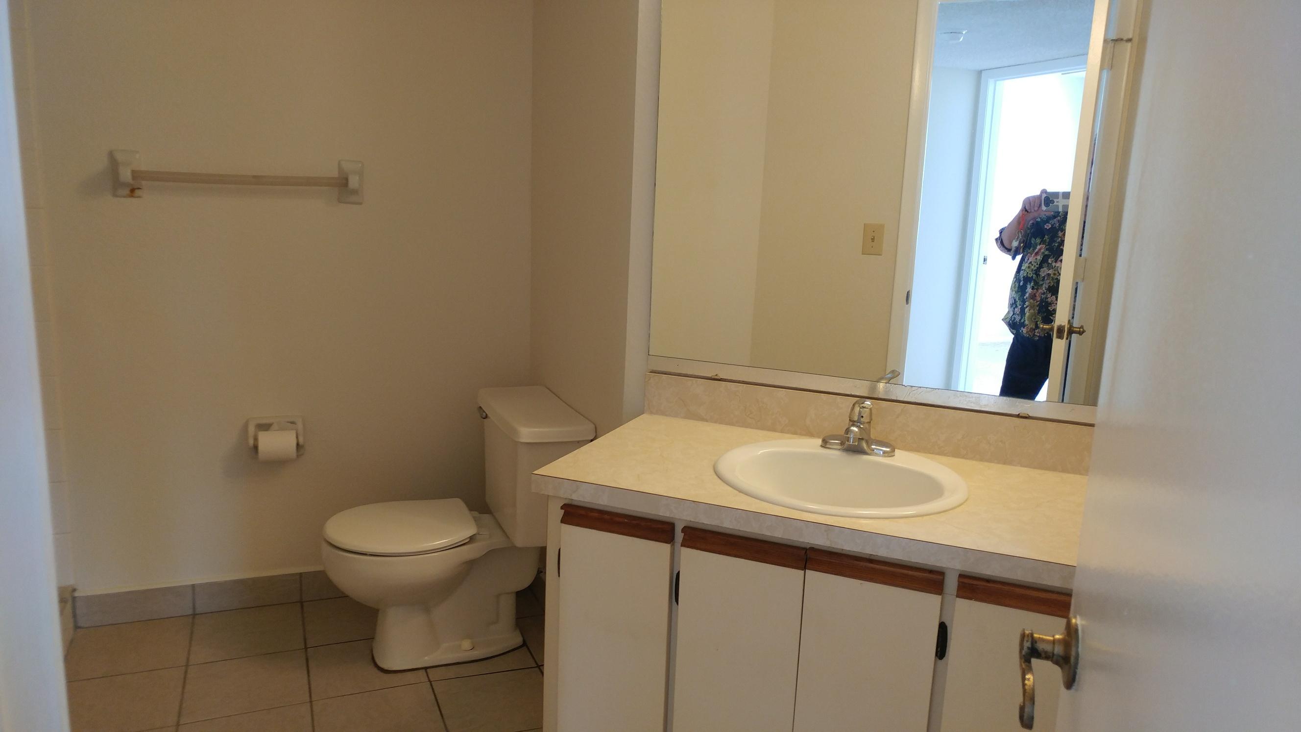 1533 Southeast Royal Green Circle, Unit 105 Port St. Lucie, FL 34952 - Photo 11 of 14 C105 Hall Bath