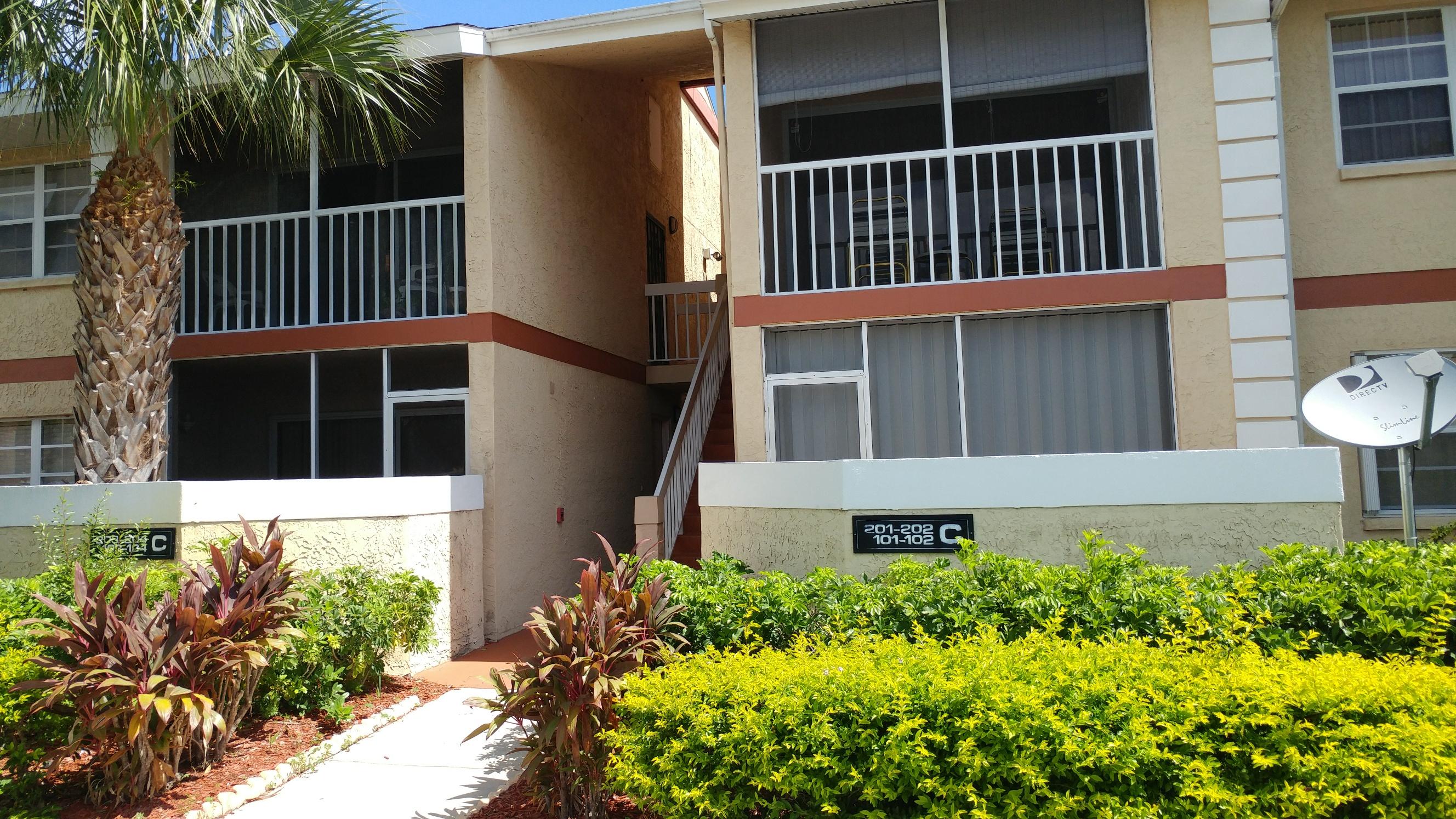 1533 Southeast Royal Green Circle, Unit 105 Port St. Lucie, FL 34952 - Photo 6 of 14 Walkway 1533