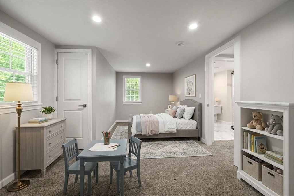 16 Churchill Road Plympton, MA 02367 - Photo 23 of 42 a spacious bedroom with a large bed and a couch