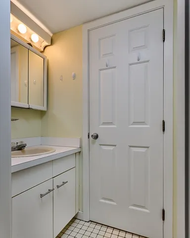 a bathroom with a sink and mirror