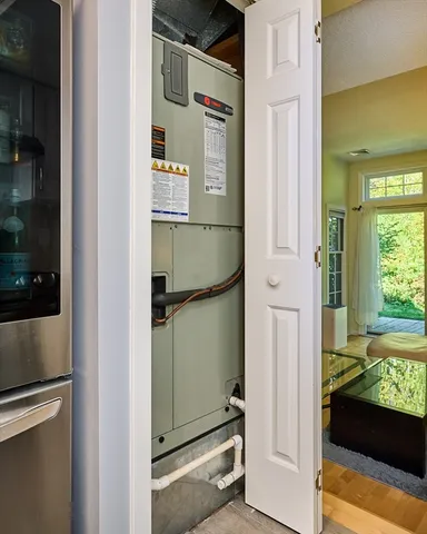 a view of a house with brick walls and flower plants