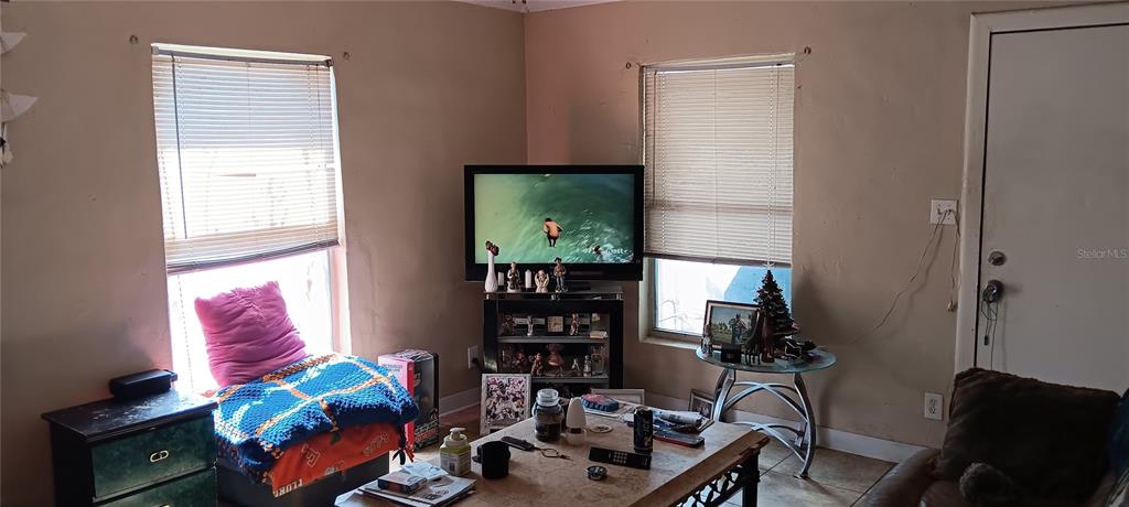 555 Lee Road Jacksonville, FL 32225 - Photo 12 of 67 a living room with furniture and a flat screen tv