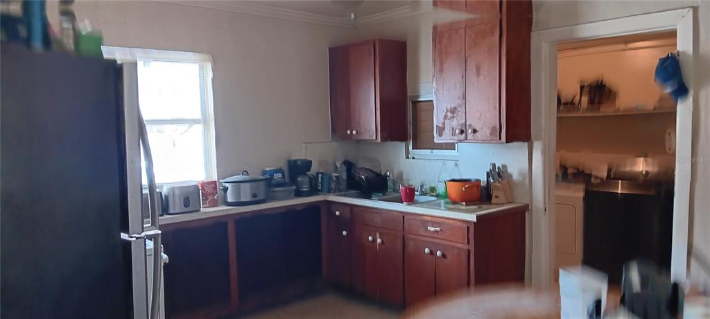 555 Lee Road Jacksonville, FL 32225 - Photo 19 of 67 a kitchen with stainless steel appliances granite countertop a sink stove and refrigerator