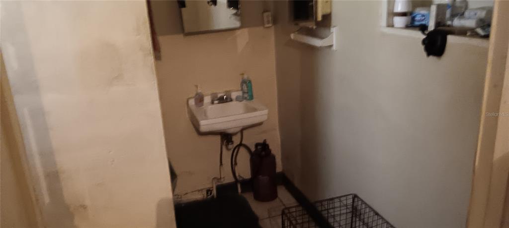 555 Lee Road Jacksonville, FL 32225 - Photo 32 of 67 a bathroom with a sink and mirror